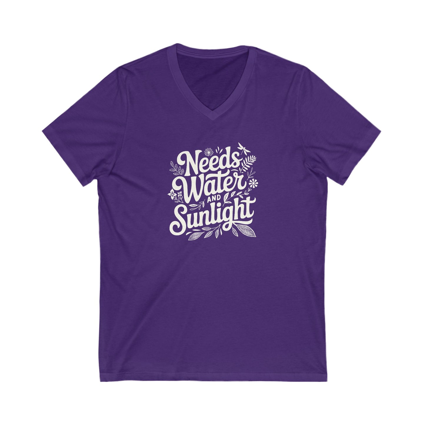 Saturated purple colored vneck t-shirt with white words that say 'Needs Water and Sunlight' in script style text with dragonfly, flower and leaf illustrations around the words.