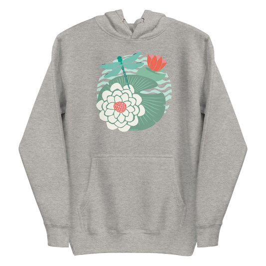 Illustrated dragonfly hovering over a green lily pad with pink and white water lily flowers on a rippled circular pond, printed on a soft premium athletic gray hoodie sweatshirt.