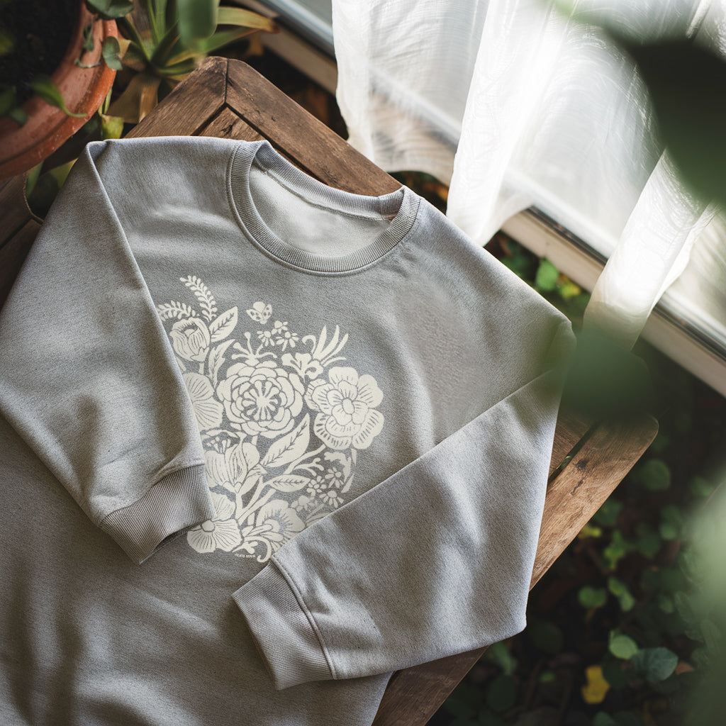woodblock carved flower graphic on crewneck sweatshirt