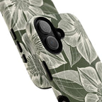 Vintage Bloom Cypress MagSafe iPhone 17 – Glossy | cypress green ground, large-scale white clematis print, angled view showing camera cutout and buttons, dual-layer protection