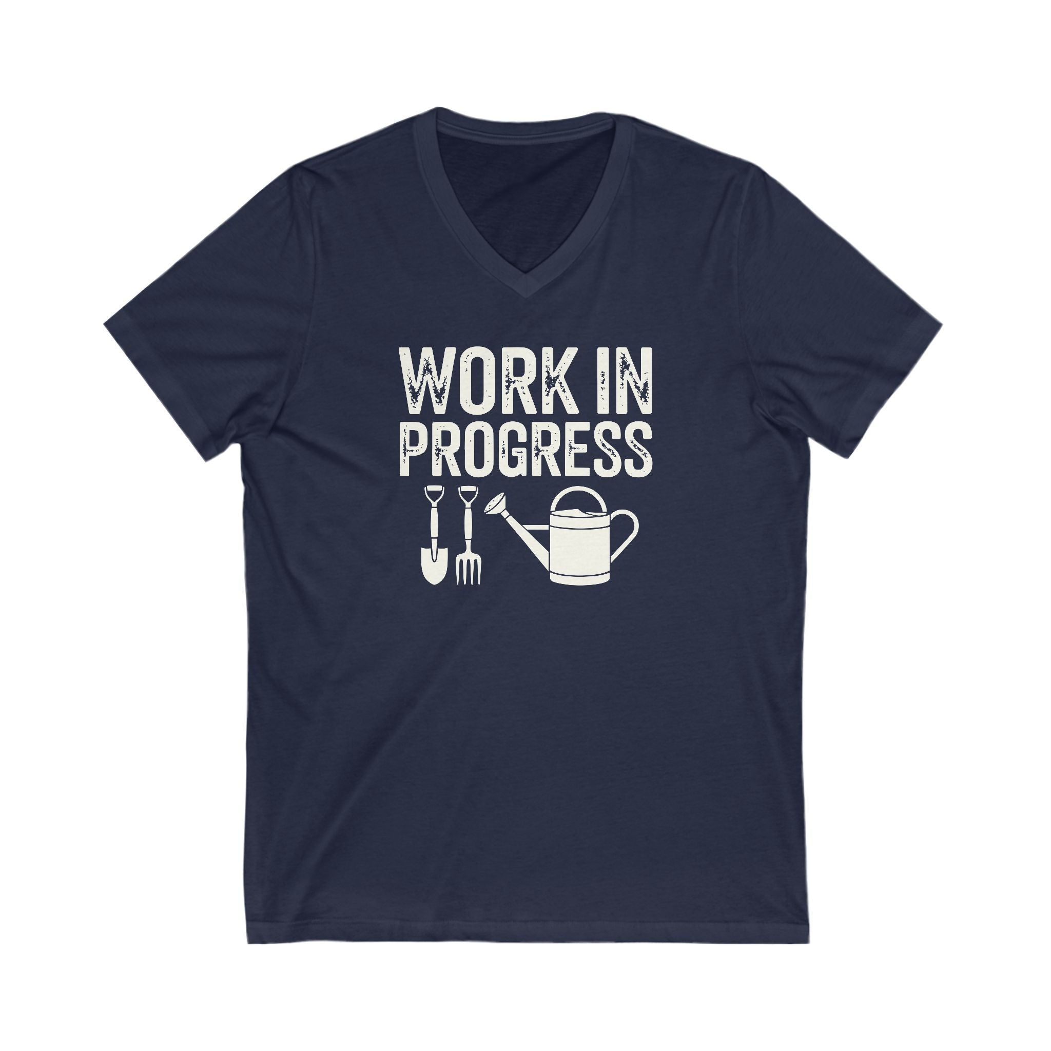 Navy Blue colored vneck t-shirt with white words that say 'Work in Progress' in distressed style text. Below the words are graphic images of gardening tools including a shovel, pitchfork and watering can.