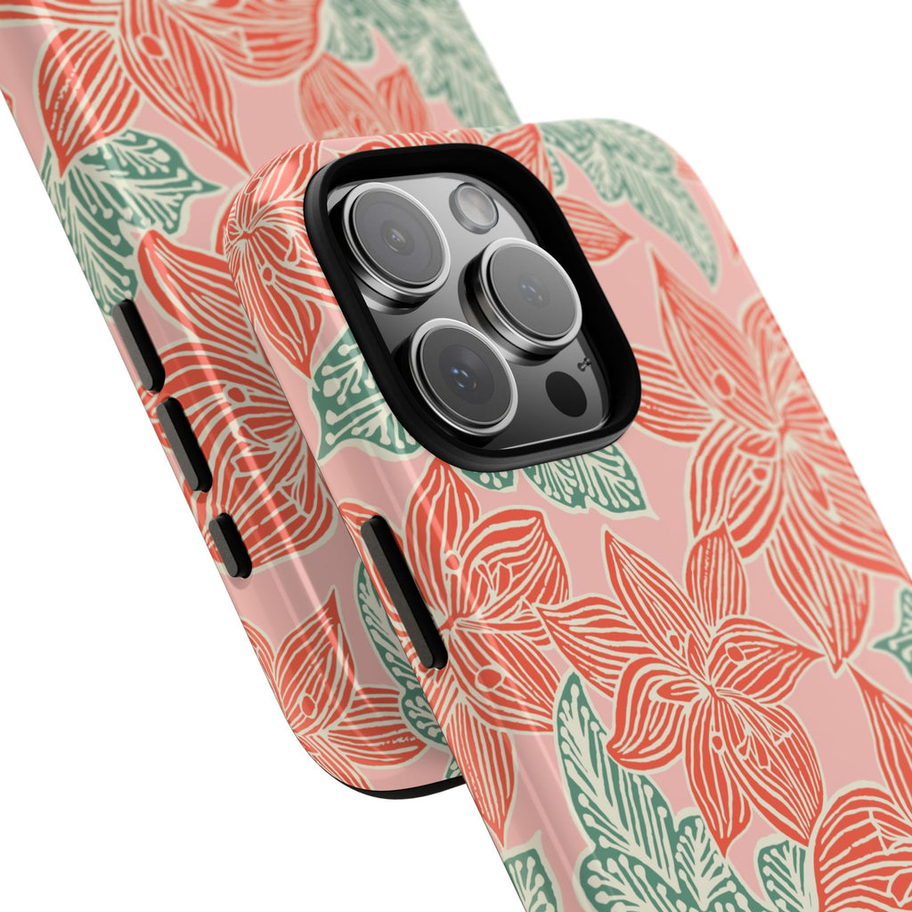 Hibiscus Coral iPhone 16 Pro Max Glossy Case — angled view showing slim profile; blush pink case with coral red hibiscus flowers and teal-green leaves in bold botanical linework