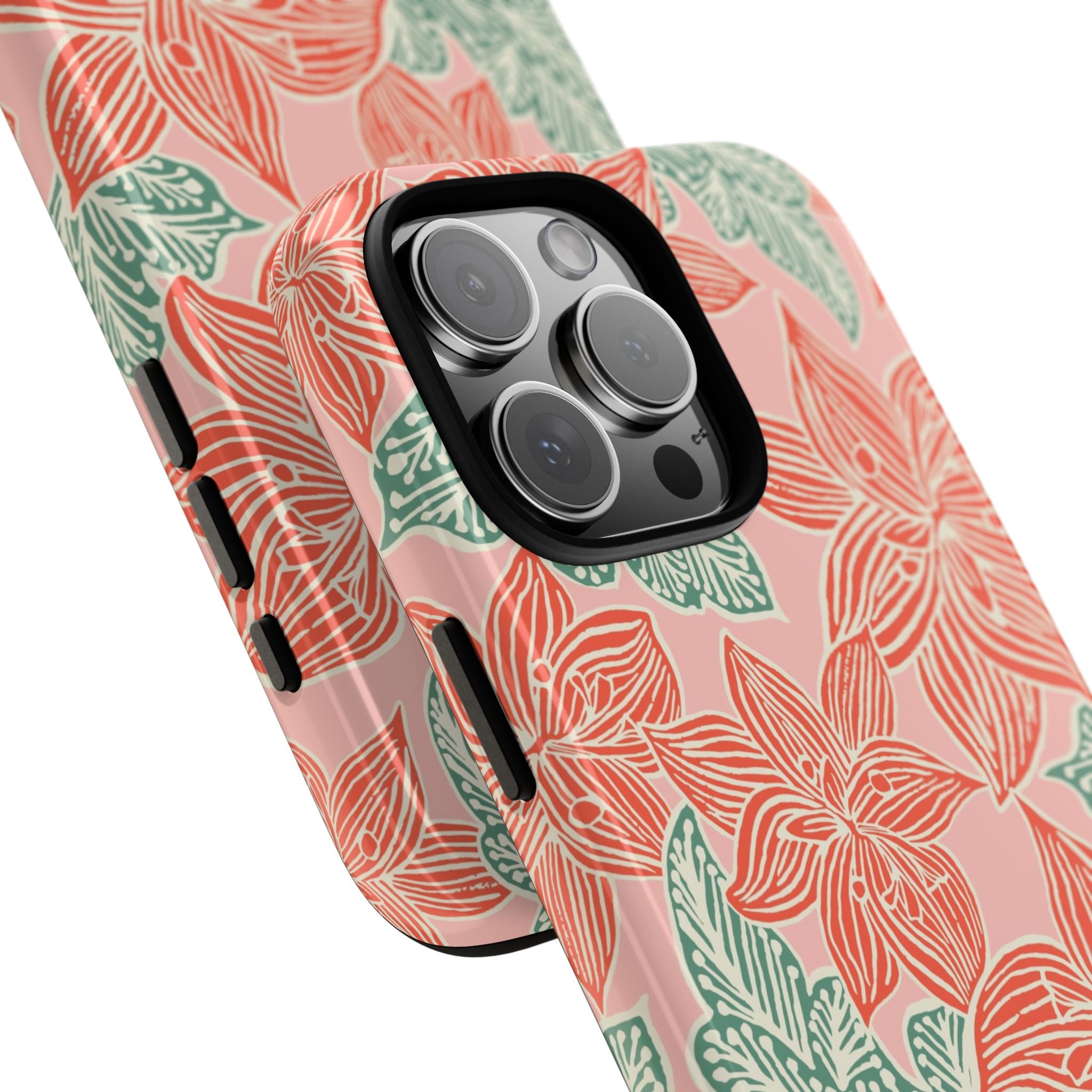 Hibiscus Coral iPhone 16 Pro Max Glossy Case — angled view showing slim profile; blush pink case with coral red hibiscus flowers and teal-green leaves in bold botanical linework