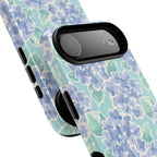 Nantucket Hydrangea MagSafe iPhone Case – lifestyle angled view of button, ports, and camera cutout. Shows raised bezel edges around camera lens.