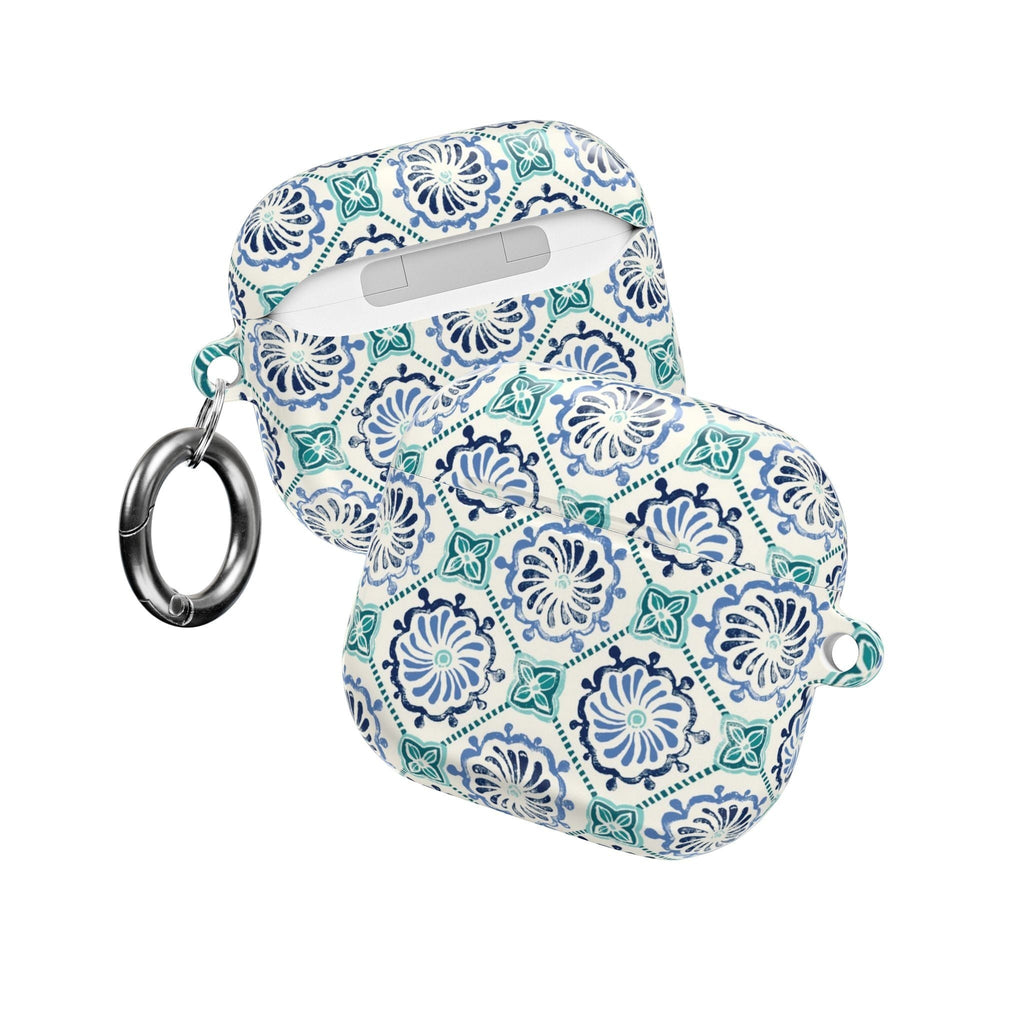 floriori Horizon Blue Tile AirPods case with a navy and teal Moroccan-inspired floral medallion print on white.