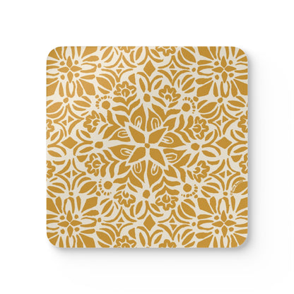 Square coaster with a yellow floral pattern on a white background