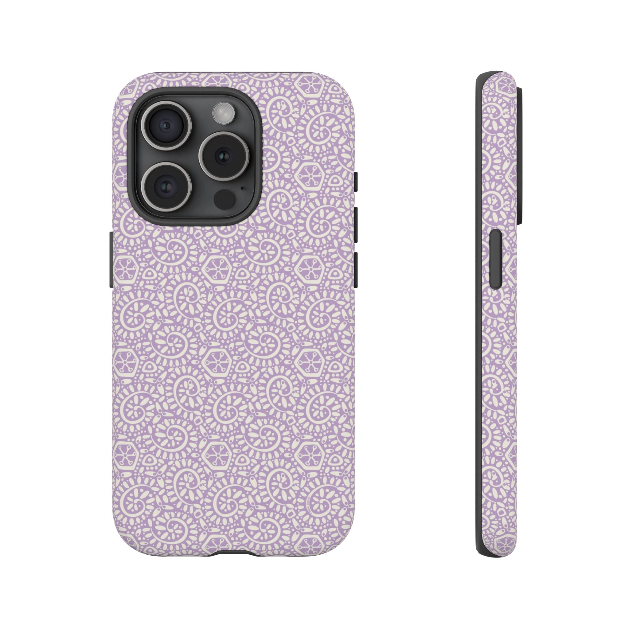 Canto Swirls Lavender iPhone 15 Pro Matte Case — lavender hard case covered in an intricate folk-art medallion pattern of radiating circular motifs, dot clusters, and geometric centers