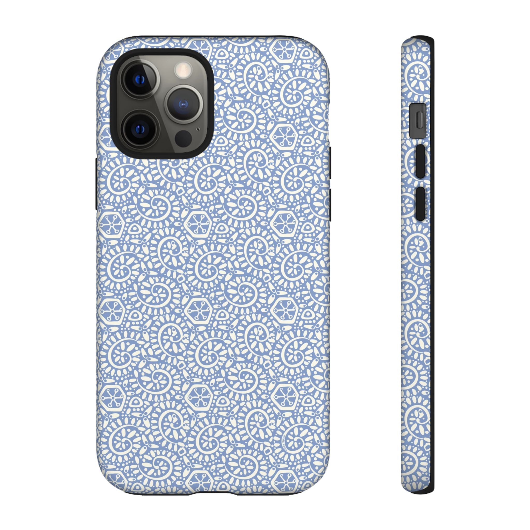 Canto Swirls Mist iPhone 12 Pro Matte Case — periwinkle blue hard case covered in an intricate folk-art medallion pattern of radiating white circular motifs, dot clusters, and geometric centers