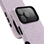 Canto Swirls Lavender MagSafe iPhone 17 Pro Max Glossy Case — angled view showing slim profile; lavender folk-art medallion pattern of radiating circular motifs, dot clusters, and geometric centers