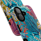 Reef MagSafe iPhone 17 Case – Glossy | teal, coral, navy, purple botanical coral reef print | angled view closeup of camera cutout and buttons