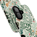 Juniper MagSafe iPhone 17 Case – Glossy | angled view closeup of camera cutout and buttons | cream, forest green, sage, and rust winter botanical print with pine, holly, acorns, and pinecones