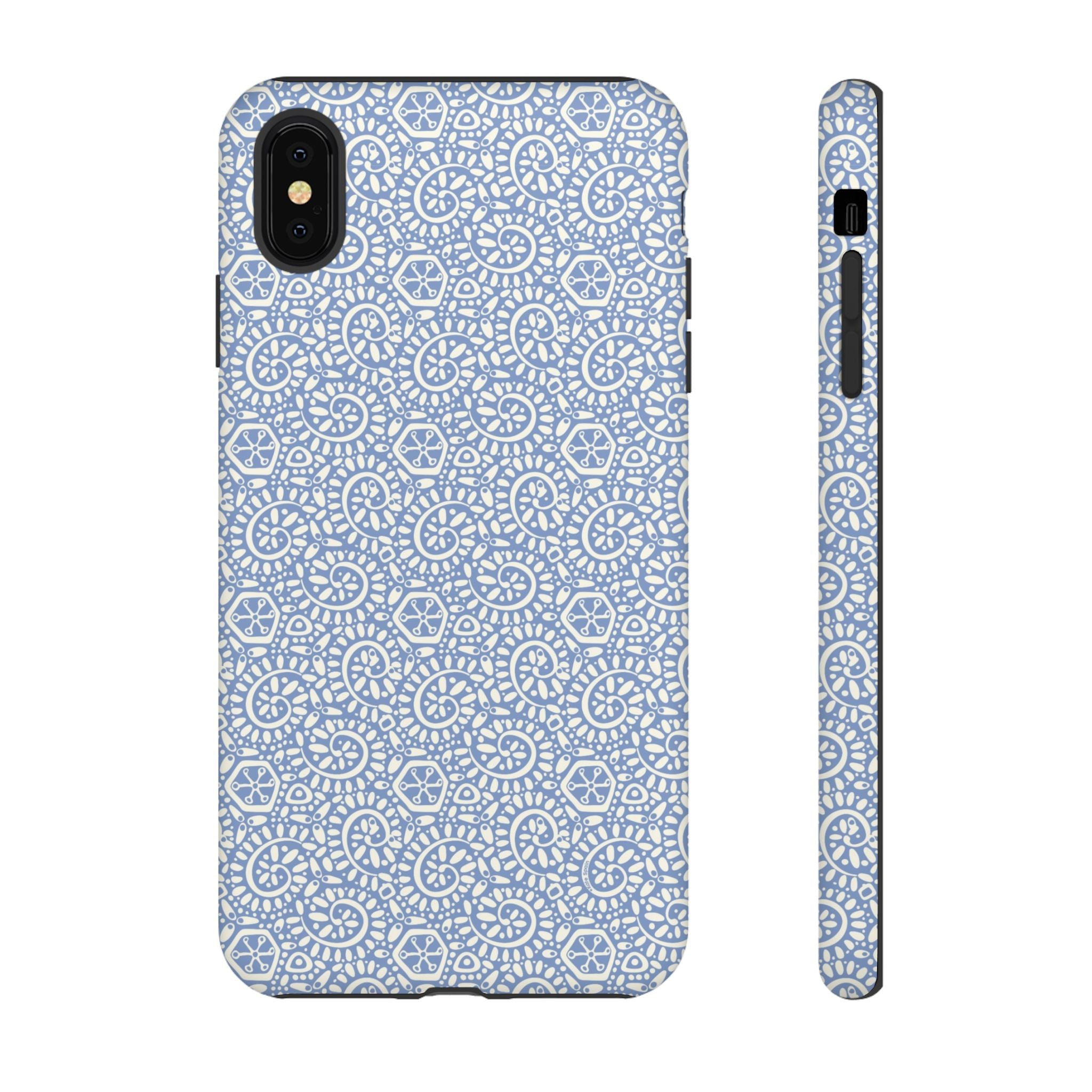 Canto Swirls Mist iPhone XS Max Matte Case — periwinkle blue hard case covered in an intricate folk-art medallion pattern of radiating white circular motifs, dot clusters, and geometric centers
