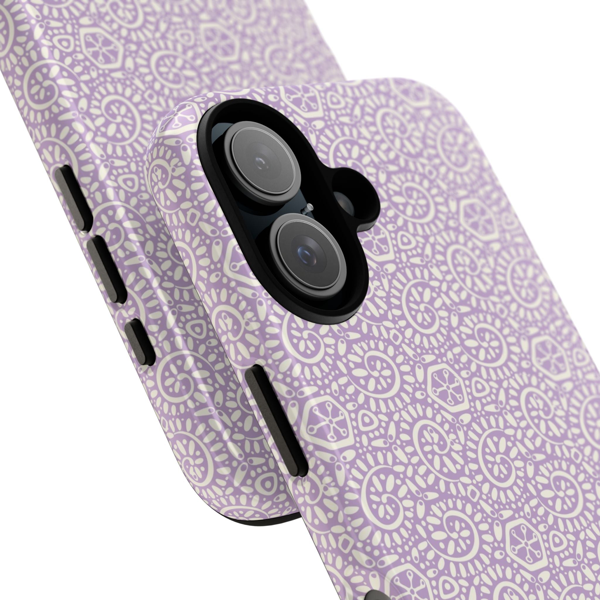 Canto Swirls Lavender iPhone 17 Glossy Case — angled view showing slim profile; lavender folk-art medallion pattern of radiating circular motifs, dot clusters, and geometric centers