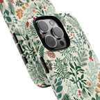Juniper MagSafe iPhone 16 Pro Max Case – Glossy | angled view closeup of camera cutout and buttons | cream, forest green, sage, and rust winter botanical print with pine, holly, acorns, and pinecones