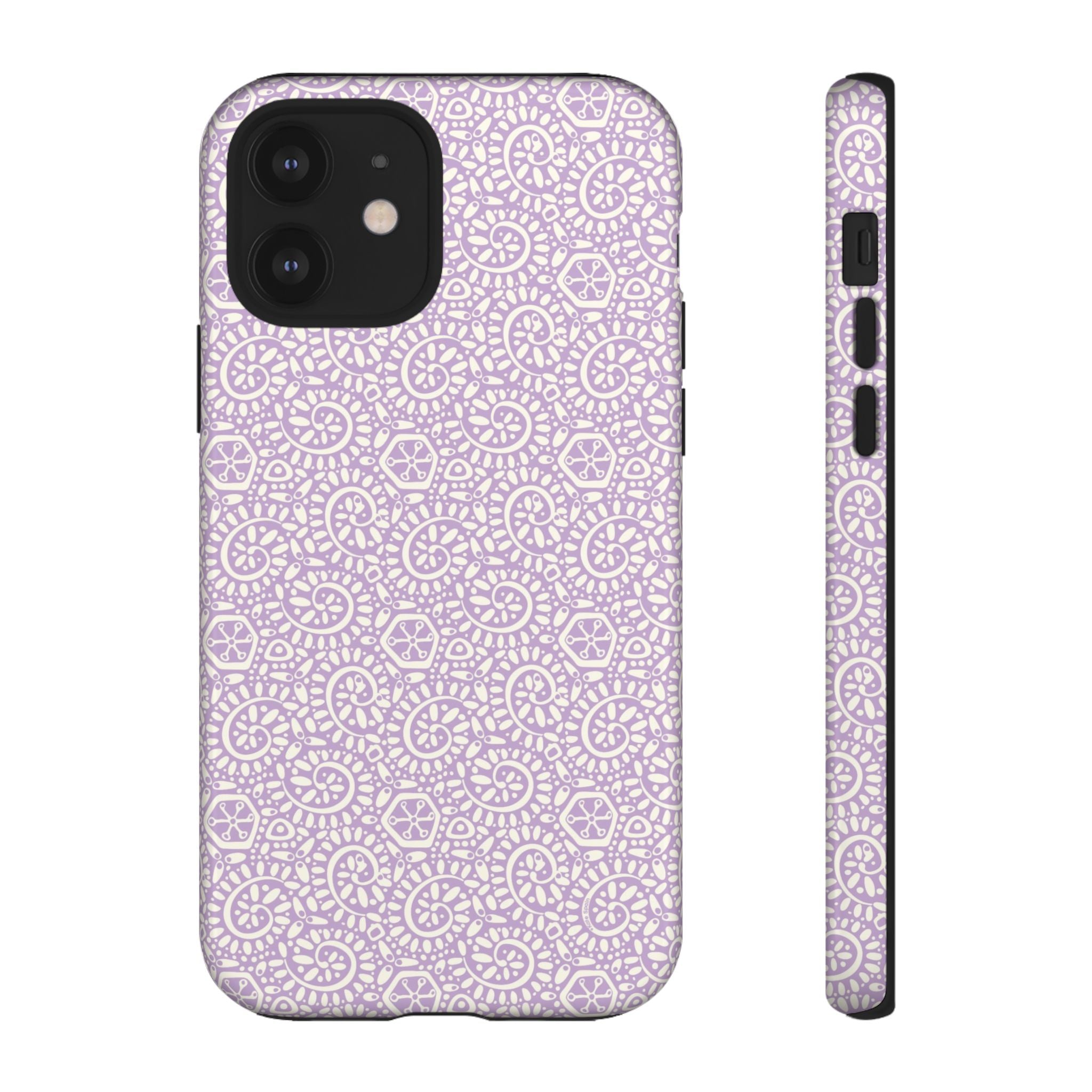 Canto Swirls Lavender iPhone 12 Glossy Case — lavender hard case covered in an intricate folk-art medallion pattern of radiating circular motifs, dot clusters, and geometric centers