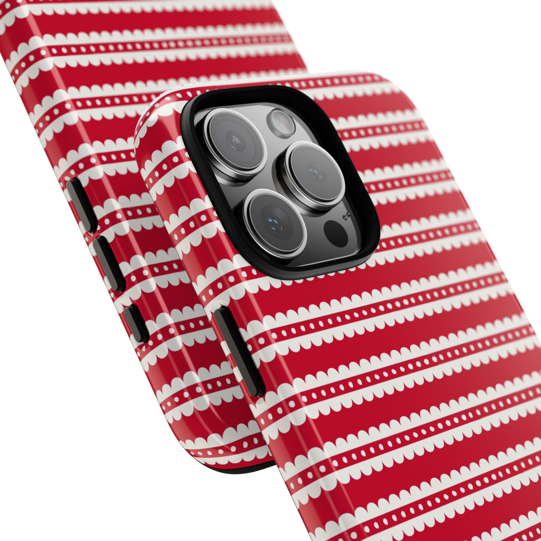 Candy Cane Stripe Tough iPhone 16 Pro Max Case – lifestyle angled view | red, cream scalloped candy cane stripe print
