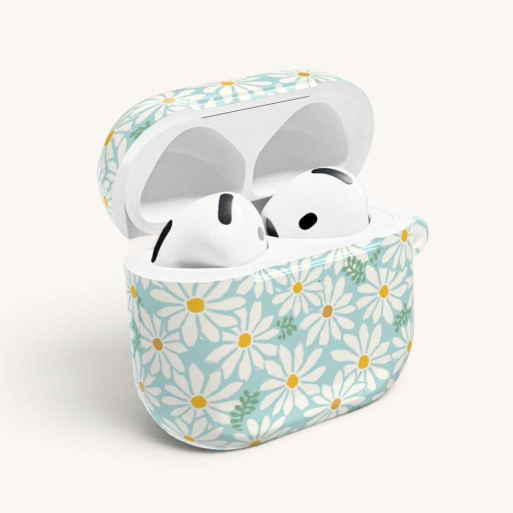 floriori Daisies AirPods Gen 4 case featuring summer white daisies with yellow centers on an aqua background with green leaves printed on glossy polycarbonate shell. Open with earbuds.