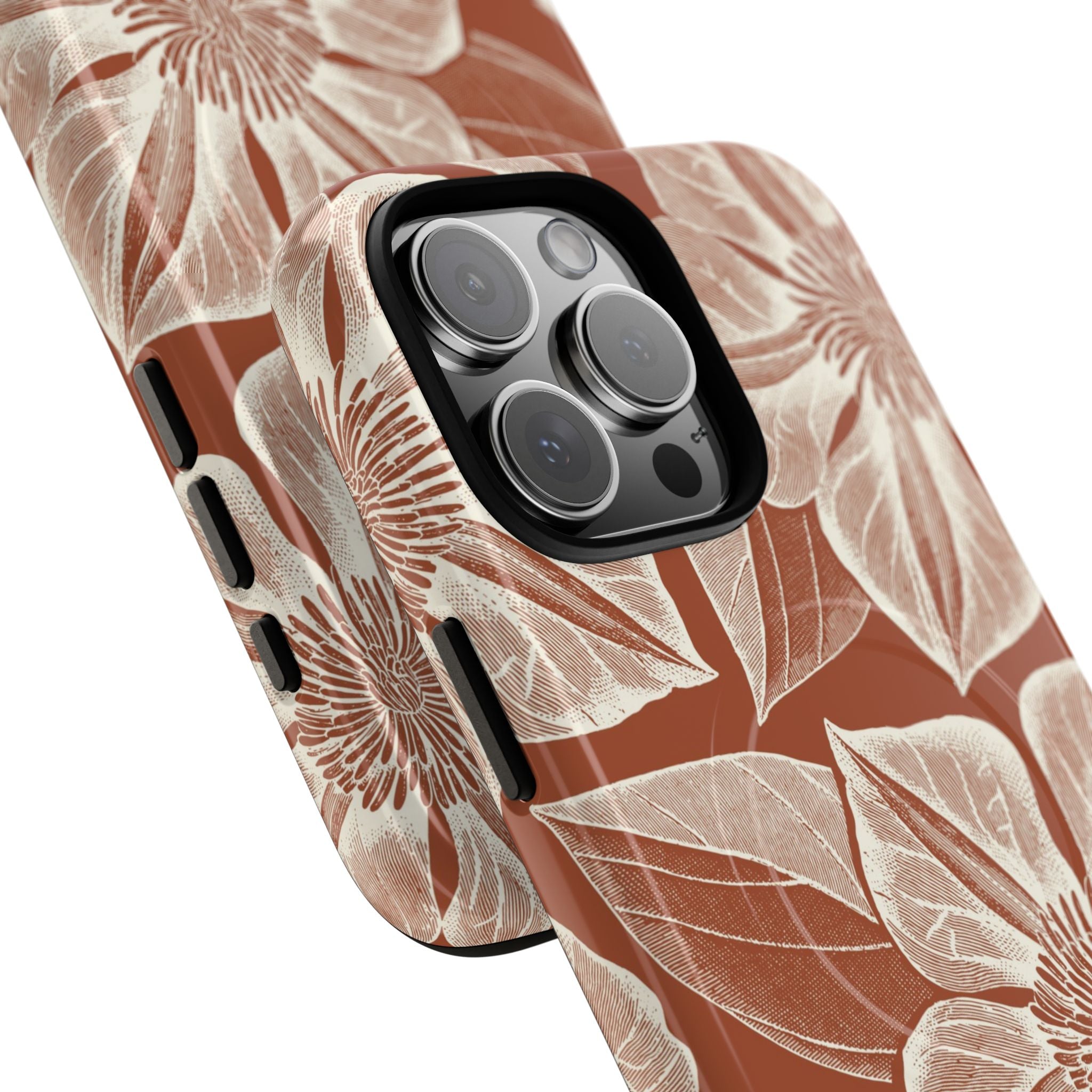 Vintage Bloom Sienna MagSafe iPhone 16 Pro Max – Glossy | sienna ground, large-scale cream clematis print, angled view showing camera cutout and buttons, dual-layer protection