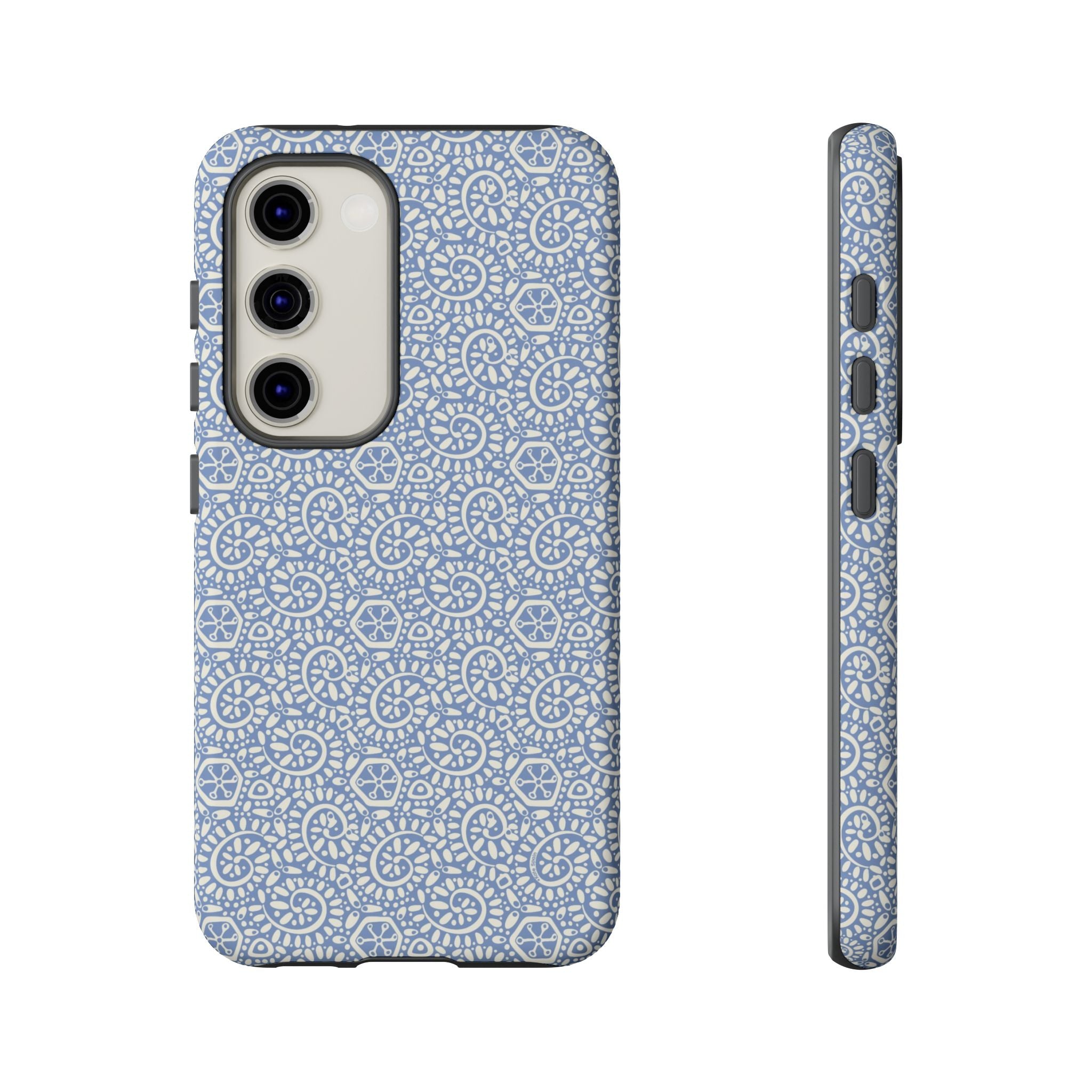 Canto Swirls Mist Samsung Galaxy S23 Matte Case — periwinkle blue hard case covered in an intricate folk-art medallion pattern of radiating white circular motifs, dot clusters, and geometric centers
