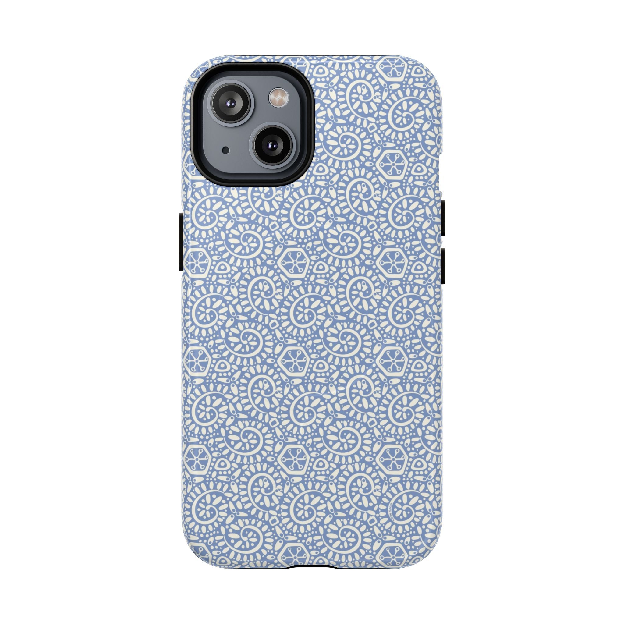 Canto Swirls Mist MagSafe iPhone 14 Glossy Case — periwinkle blue hard case covered in an intricate folk-art medallion pattern of radiating white circular motifs, dot clusters, and geometric centers