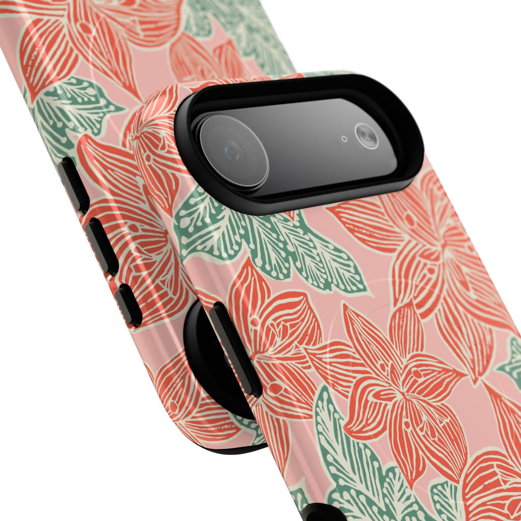 Hibiscus Coral MagSafe iPhone 17 Air Glossy Case — angled view showing slim profile; blush pink case with coral red hibiscus flowers and teal-green leaves in bold botanical linework