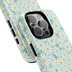 Daisies MagSafe iPhone 16 Pro Max Case – Glossy | sky blue, white daisy print, golden yellow centers, mint green leaves | angled view closeup of camera cutout and buttons