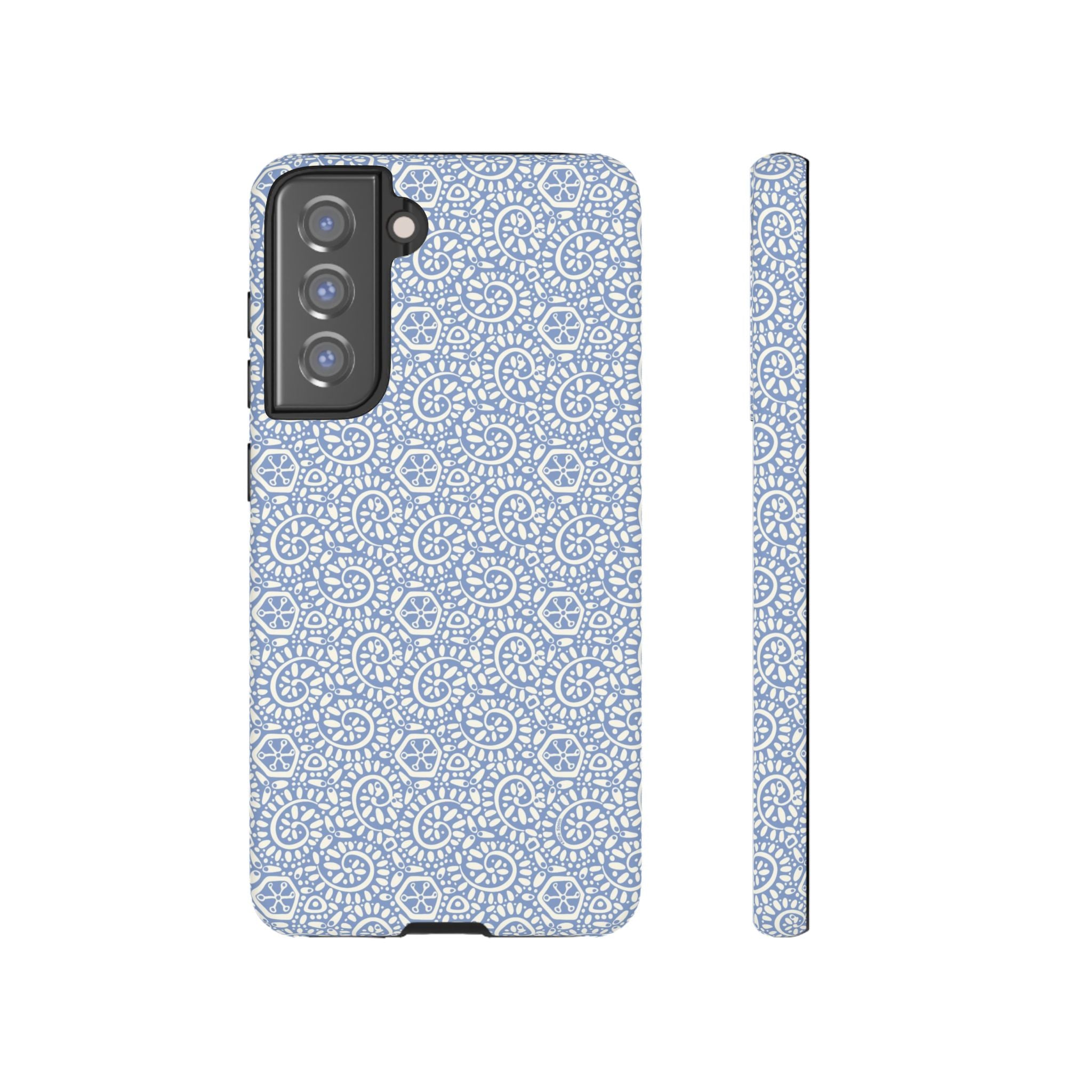 Canto Swirls Mist Samsung Galaxy S21 FE Matte Case — periwinkle blue hard case covered in an intricate folk-art medallion pattern of radiating white circular motifs, dot clusters, and geometric centers