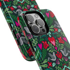Rosemaling Tough iPhone 16 Pro Max Case – lifestyle/angled shot | dark green, red, pink, gray folk art floral bird print