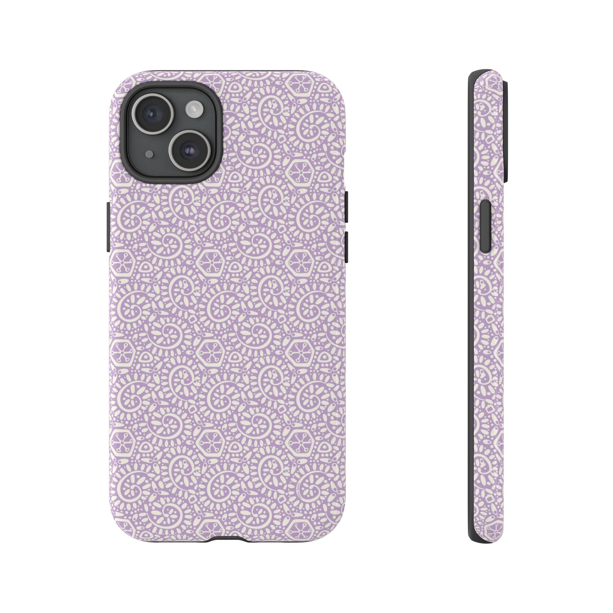 Canto Swirls Lavender iPhone 15 Plus Glossy Case — lavender hard case covered in an intricate folk-art medallion pattern of radiating circular motifs, dot clusters, and geometric centers
