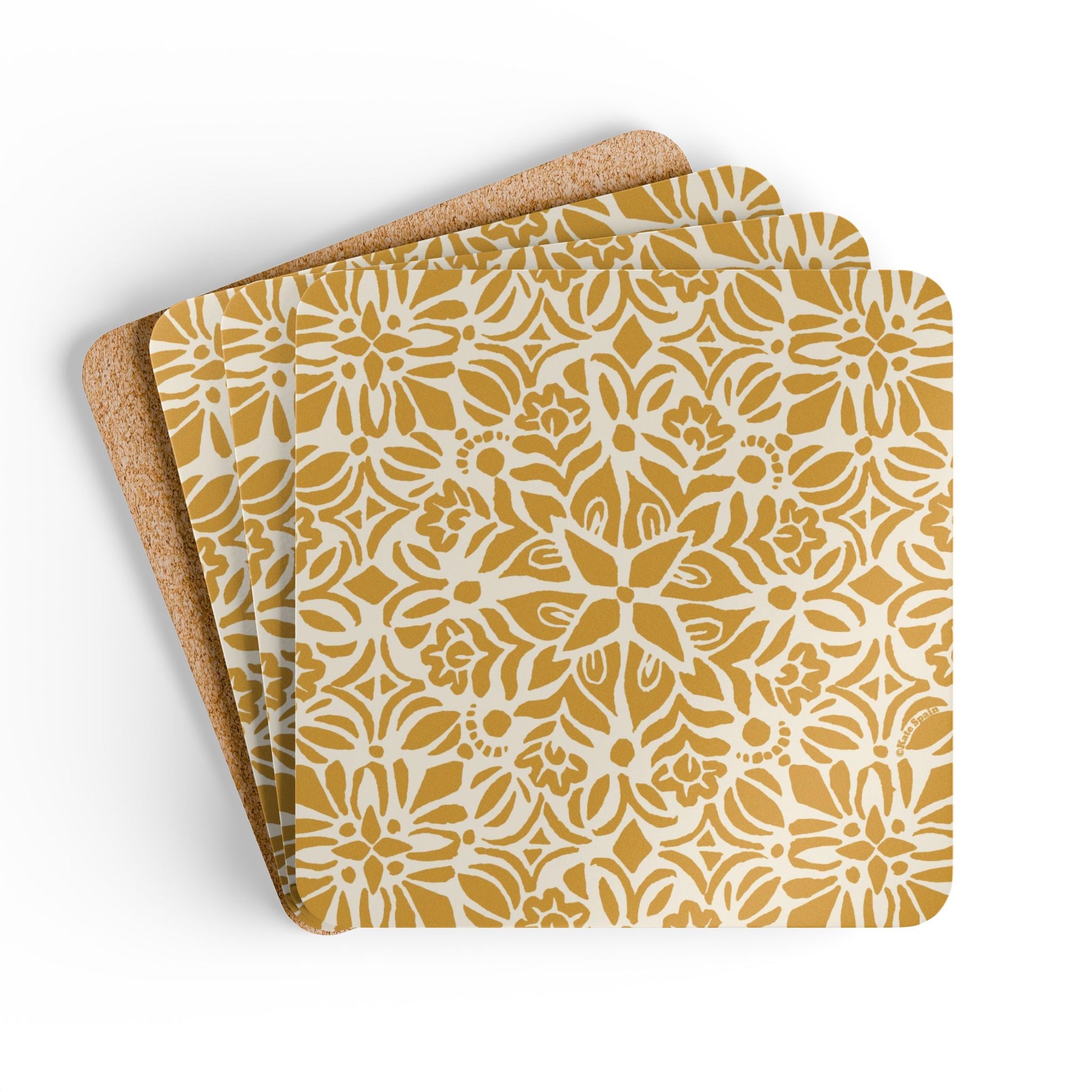 Set of three coasters with a yellow floral pattern on a white background