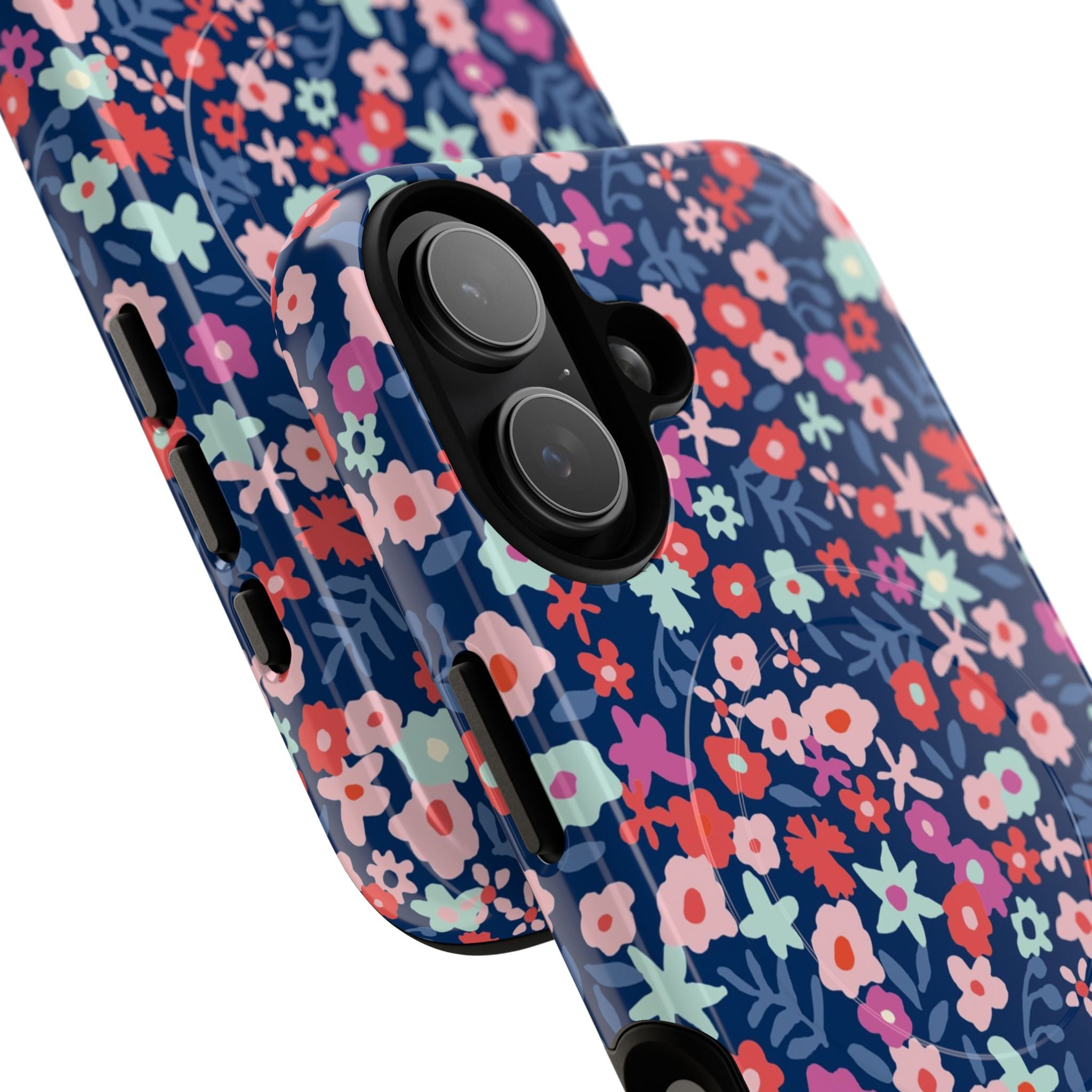 Primrose MagSafe iPhone 17 Case – Glossy | navy, pink, white ditsy floral print | angled view closeup of camera cutout and buttons