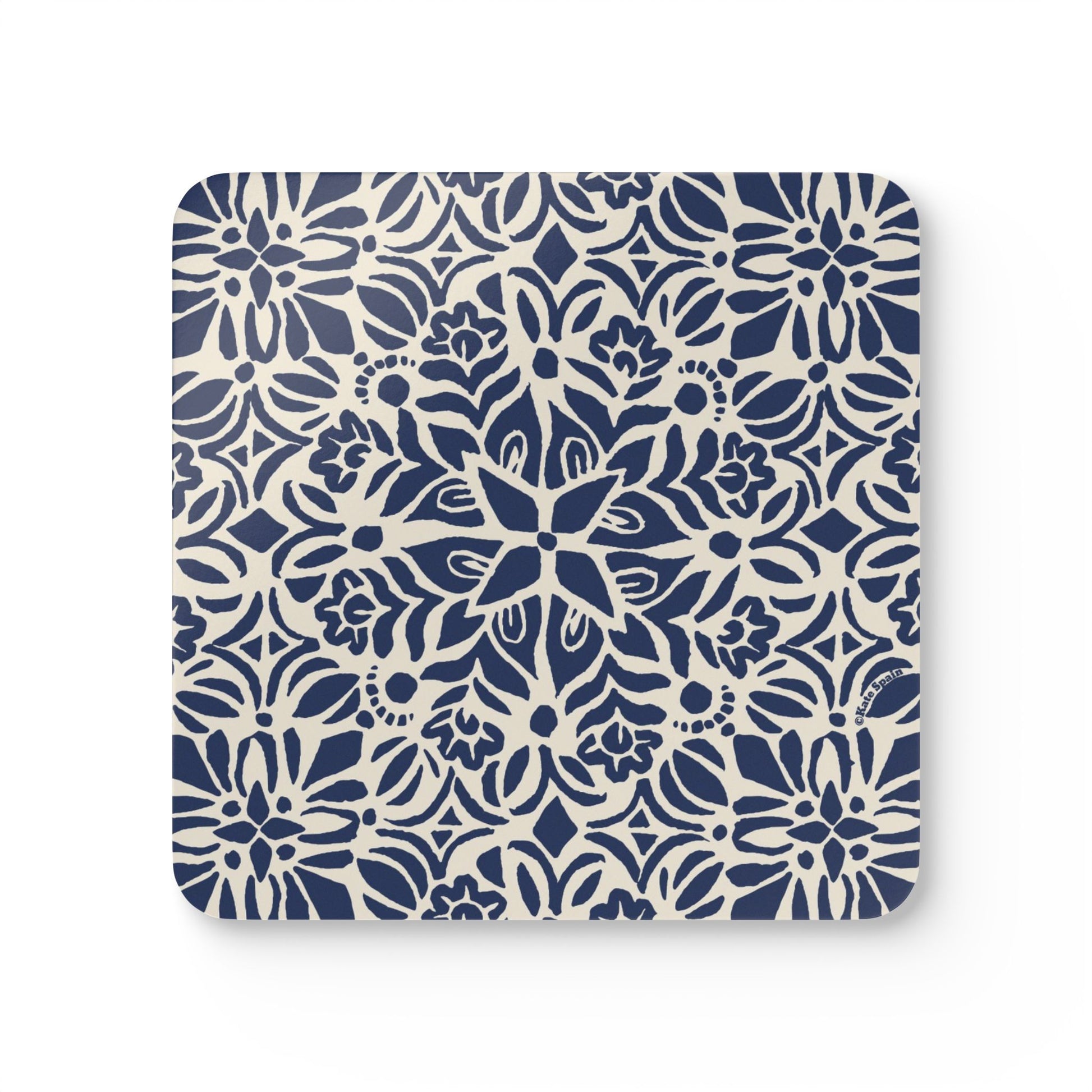 Square beverage coaster with blue floral pattern on a white background