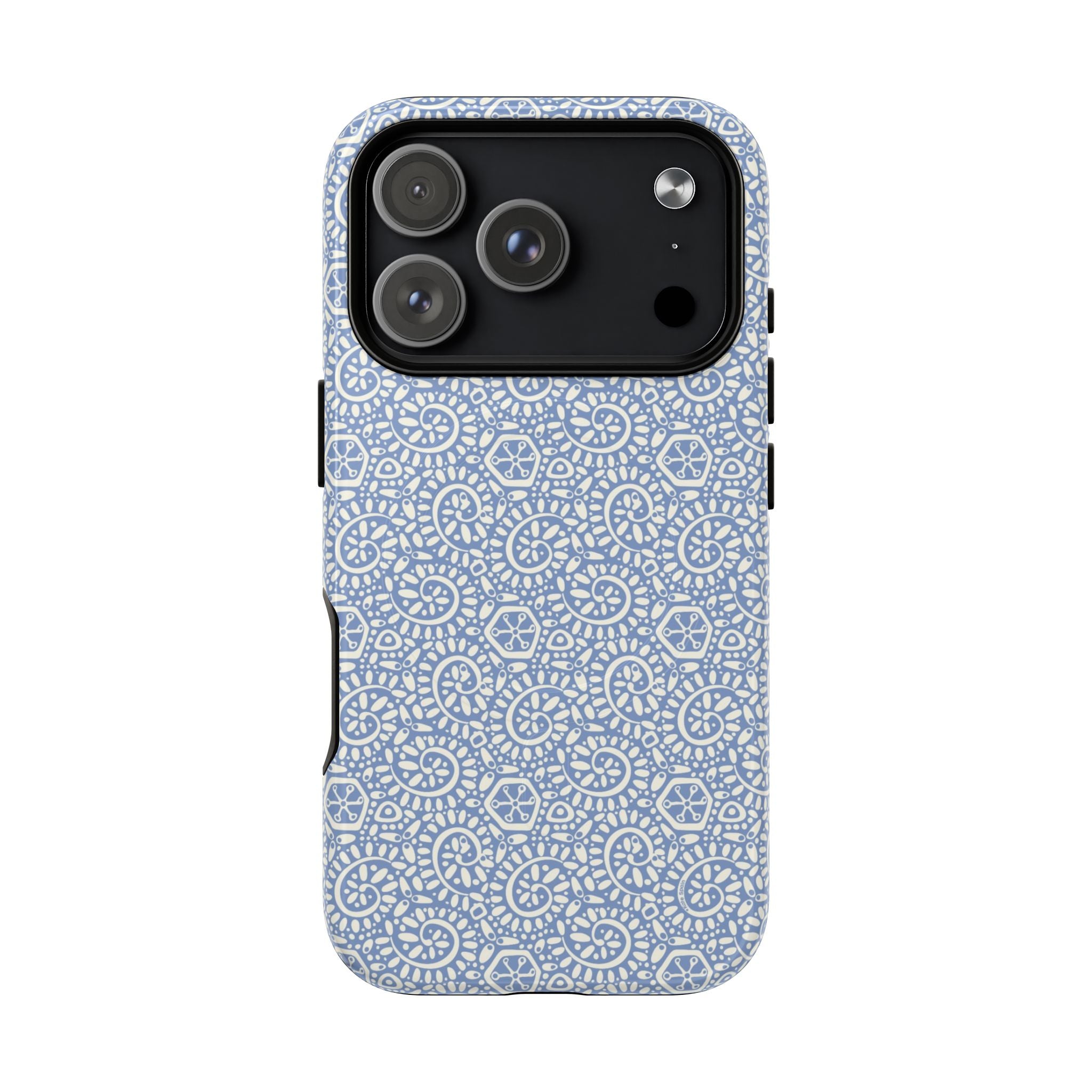 Canto Swirls Mist MagSafe iPhone 17 Pro Glossy Case — periwinkle blue hard case covered in an intricate folk-art medallion pattern of radiating white circular motifs, dot clusters, and geometric centers