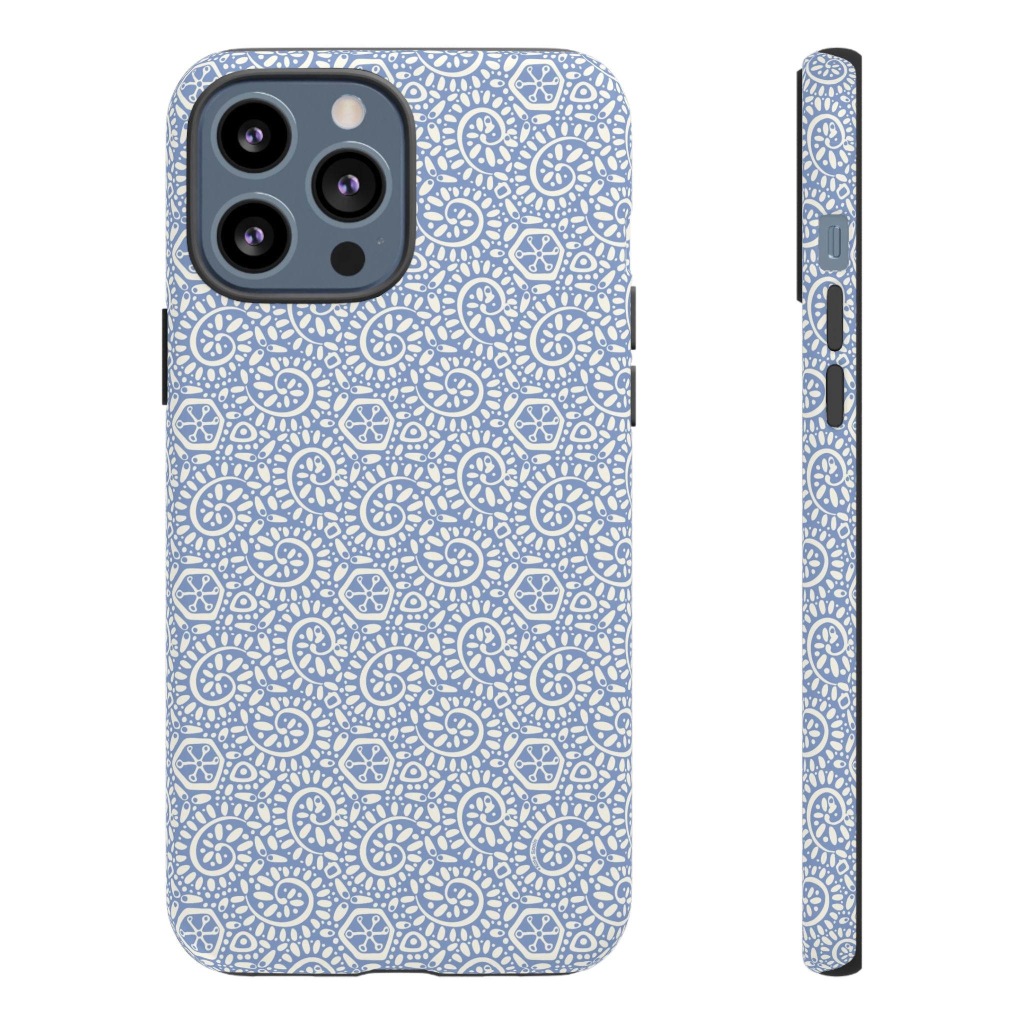 Canto Swirls Mist iPhone 13 Pro Max Matte Case — periwinkle blue hard case covered in an intricate folk-art medallion pattern of radiating white circular motifs, dot clusters, and geometric centers