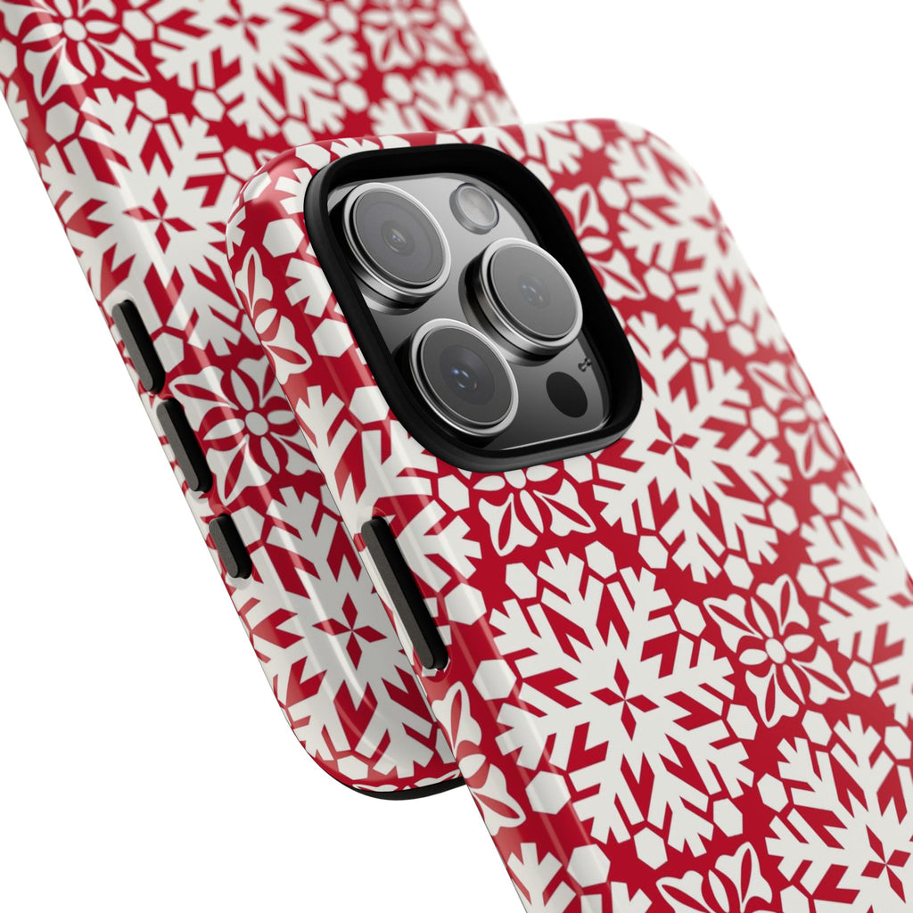 Flurry Tough iPhone 16 Pro Max Case – lifestyle/angled shot | red, cream geometric snowflake medallion print