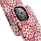 Flurry Tough iPhone 16 Pro Max Case – lifestyle/angled shot | red, cream geometric snowflake medallion print