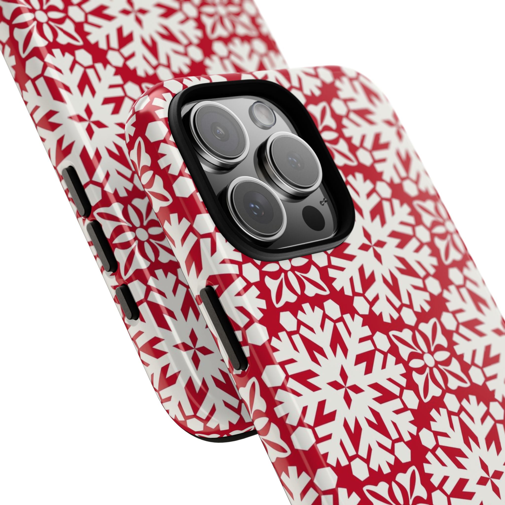 Flurry Tough iPhone 16 Pro Max Case – lifestyle/angled shot | red, cream geometric snowflake medallion print