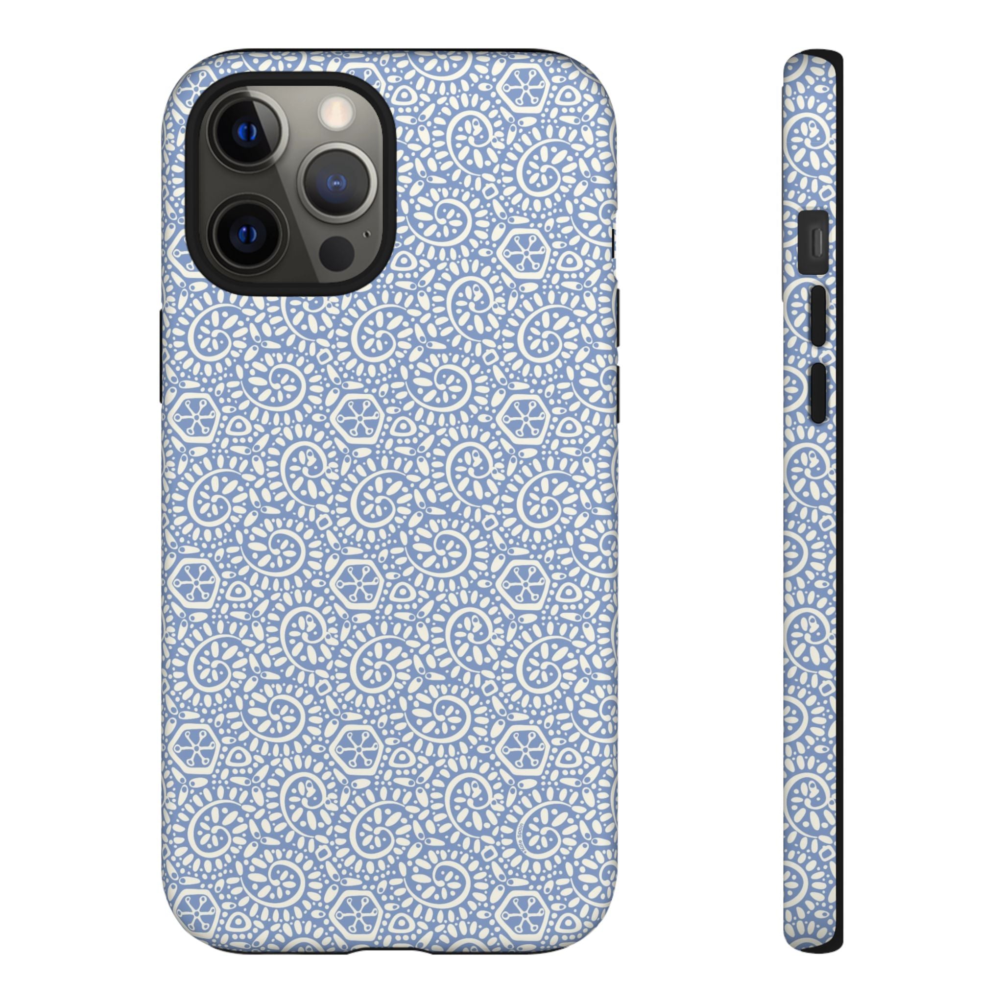 Canto Swirls Mist iPhone 12 Pro Max Matte Case — periwinkle blue hard case covered in an intricate folk-art medallion pattern of radiating white circular motifs, dot clusters, and geometric centers