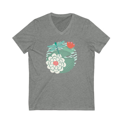 Illustrated dragonfly hovering over a green lily pad with pink and white water lily flowers on a calm pond, printed on a soft medium gray vneck t-shirt.