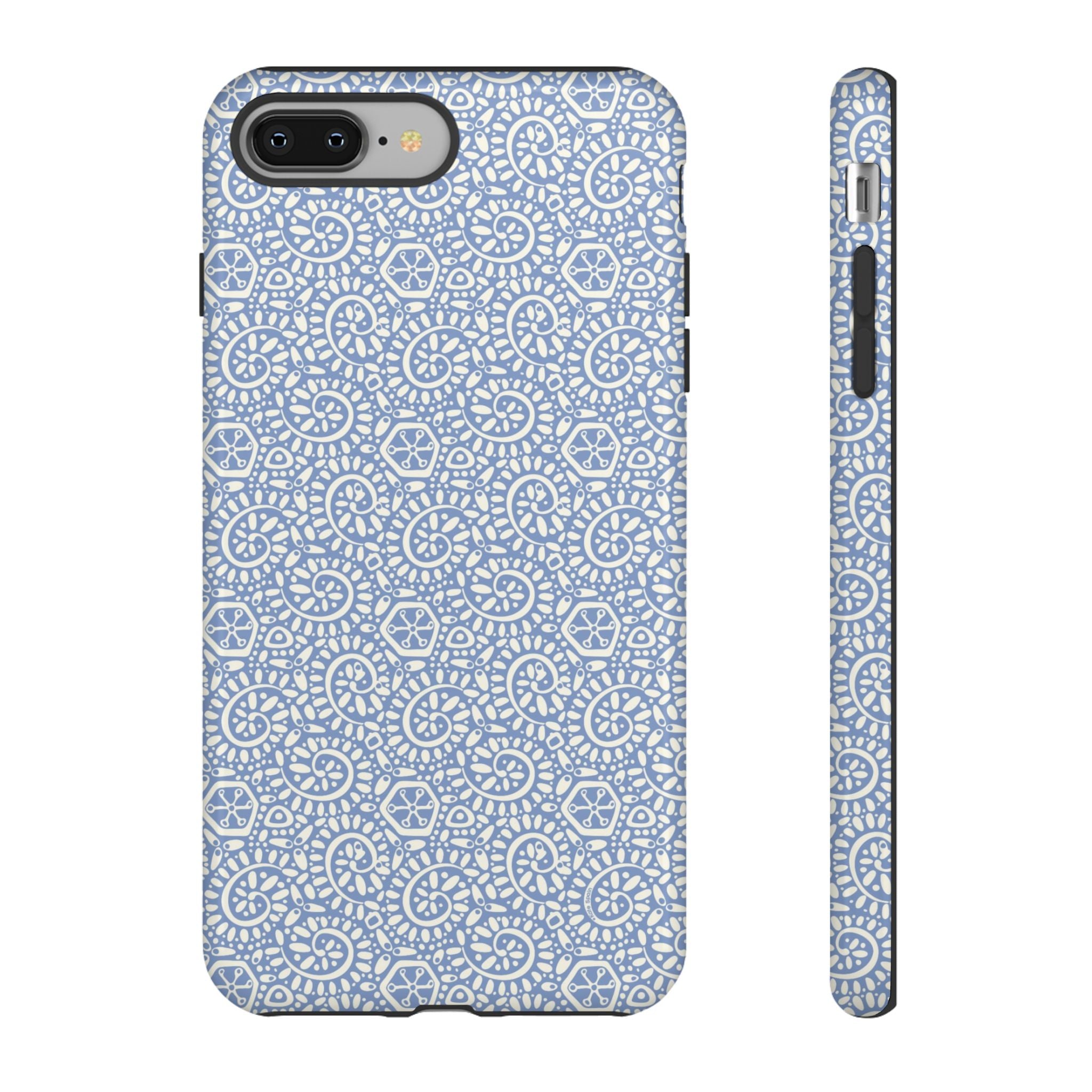 Canto Swirls Mist iPhone 8 Plus Glossy Case — periwinkle blue hard case covered in an intricate folk-art medallion pattern of radiating white circular motifs, dot clusters, and geometric centers