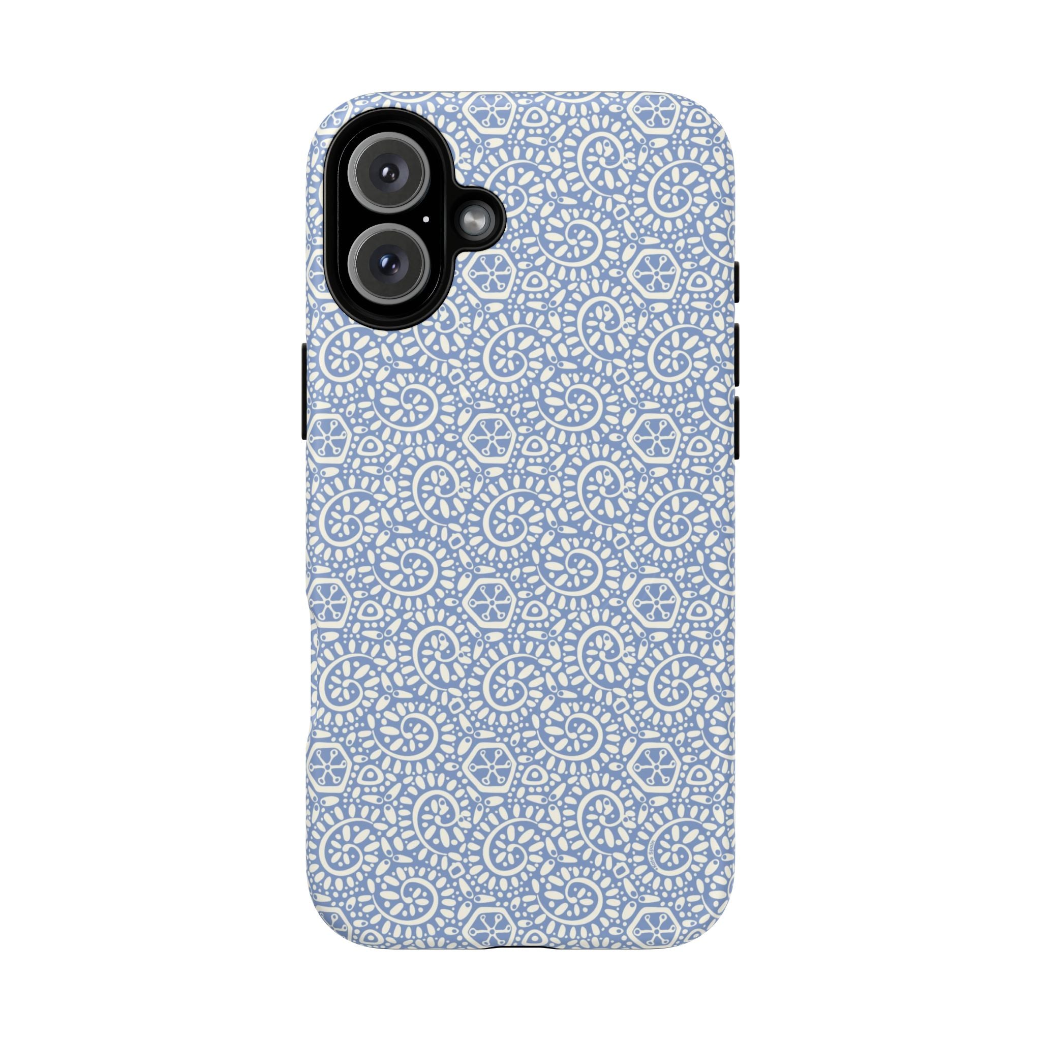 Canto Swirls Mist MagSafe iPhone 16 Plus Matte Case — periwinkle blue hard case covered in an intricate folk-art medallion pattern of radiating white circular motifs, dot clusters, and geometric centers