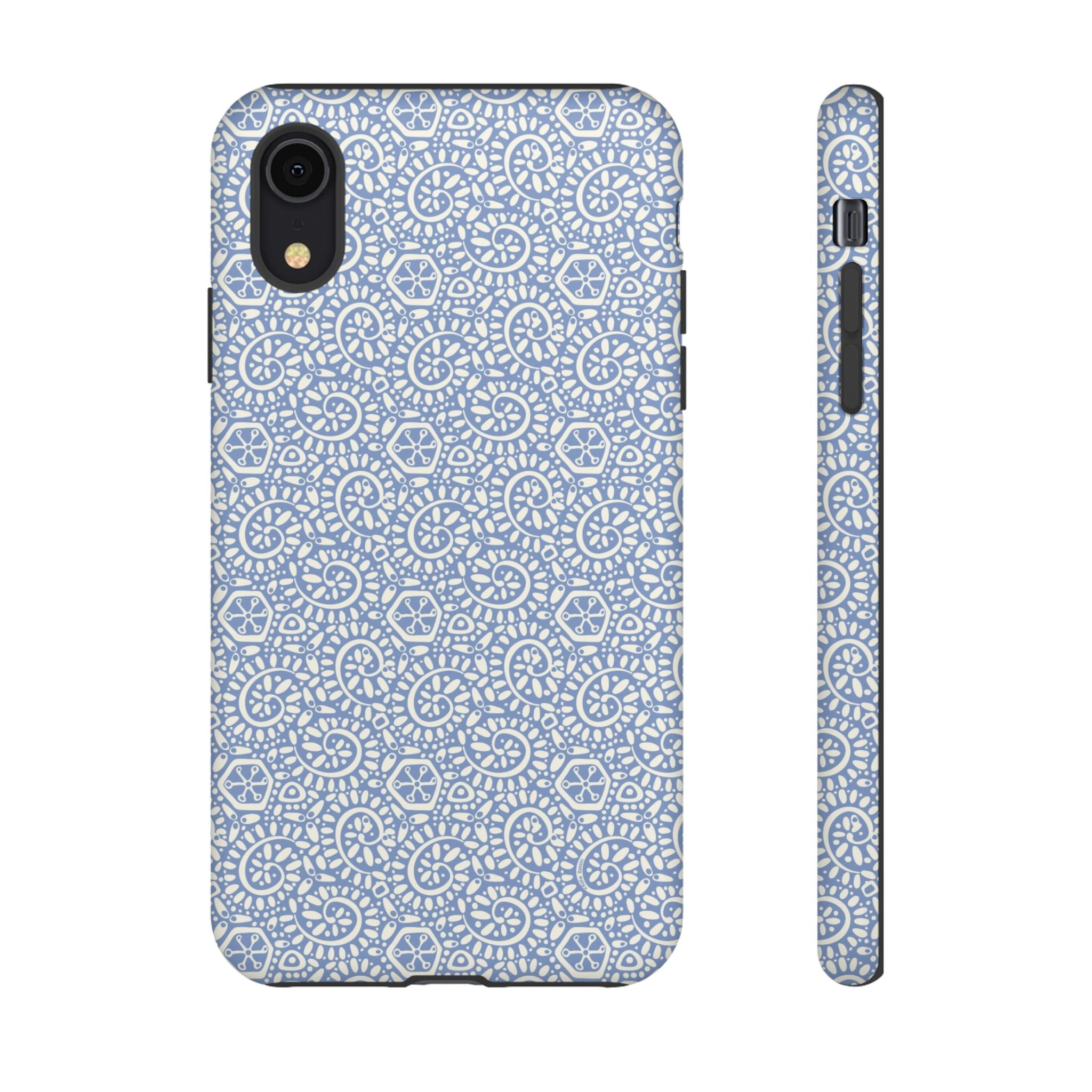 Canto Swirls Mist iPhone XR Matte Case — periwinkle blue hard case covered in an intricate folk-art medallion pattern of radiating white circular motifs, dot clusters, and geometric centers