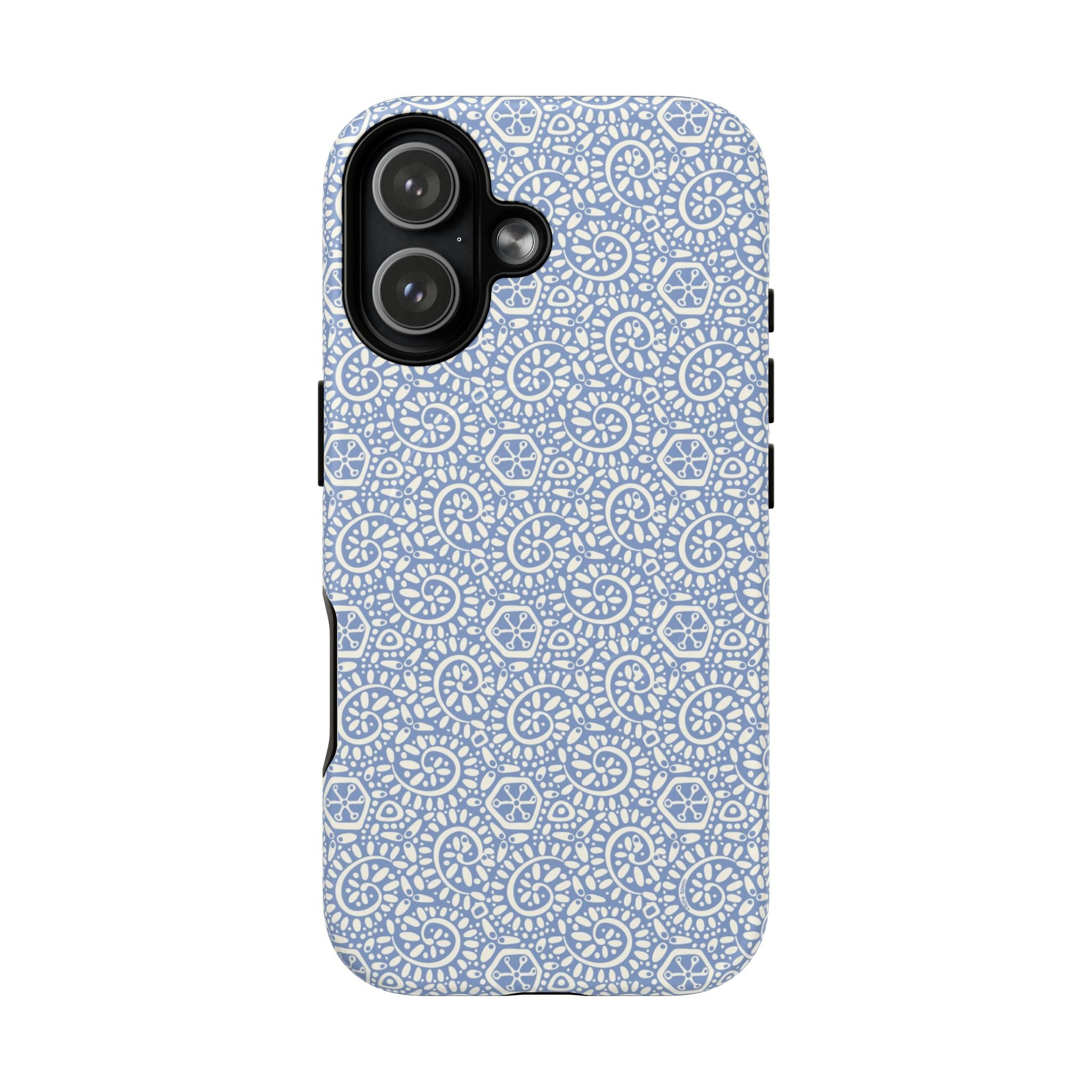 Canto Swirls Mist MagSafe iPhone 17 Glossy Case — periwinkle blue hard case covered in an intricate folk-art medallion pattern of radiating white circular motifs, dot clusters, and geometric centers