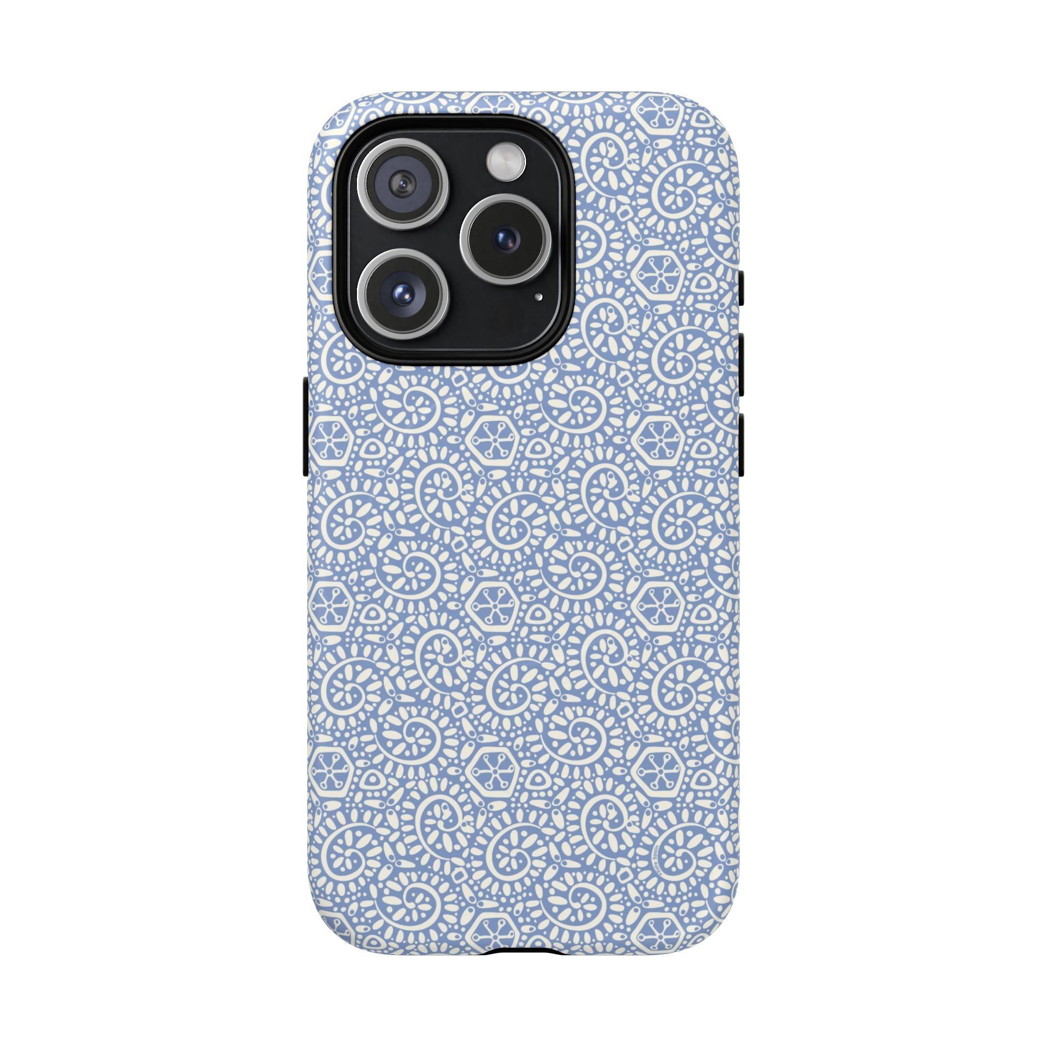 Canto Swirls Mist MagSafe iPhone 15 Pro Matte Case — periwinkle blue hard case covered in an intricate folk-art medallion pattern of radiating white circular motifs, dot clusters, and geometric centers