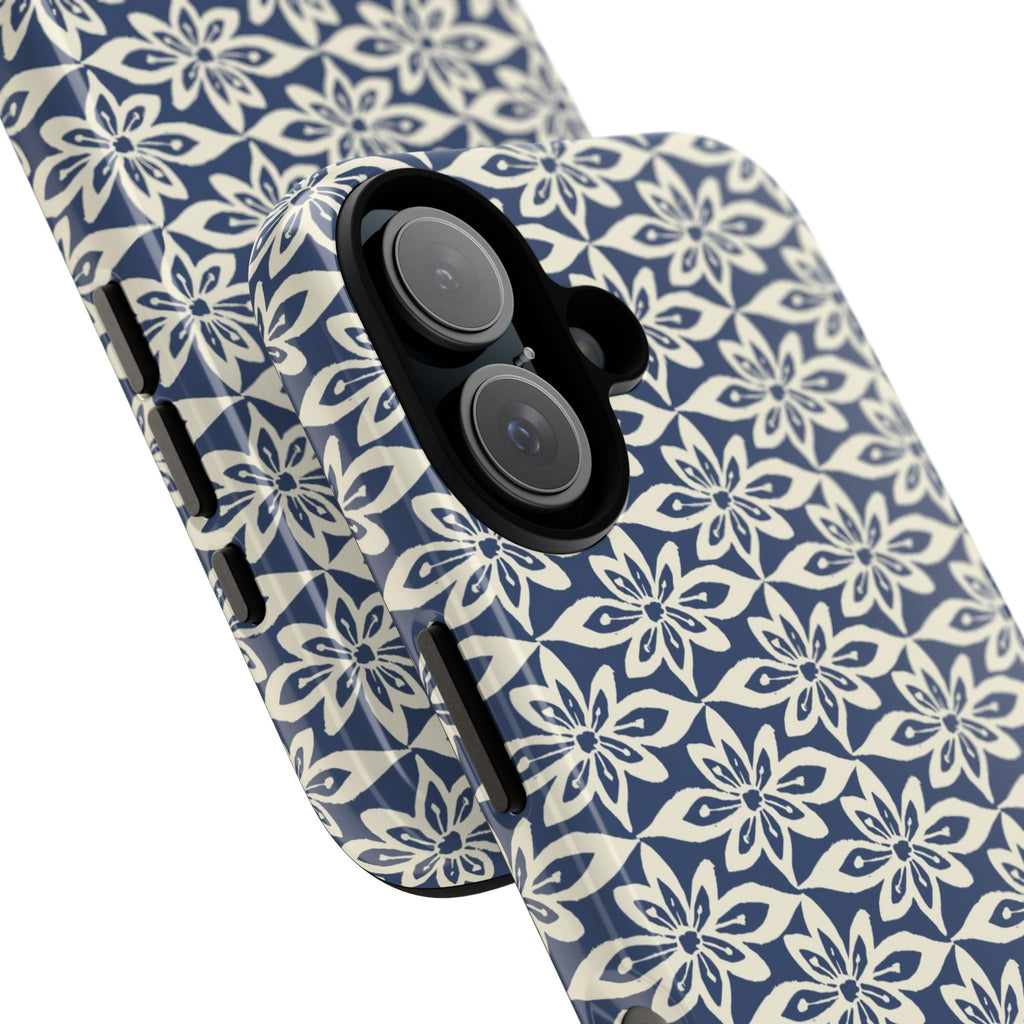 Lily Navy iPhone 17 Case – Glossy | angled view showing camera cutout and buttons — botanical phone case by Kate Spain