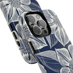 Vintage Bloom Navy iPhone 16 Pro Max case – Glossy | navy ground, large-scale cream clematis print, angled view showing camera cutout and buttons, dual-layer protection