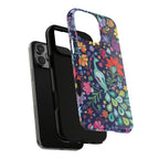 Peacock Sanctuary MagSafe iPhone 16 Pro Max Case – Dual-layered view of case and inner lining in front of phone, with view of camera cutout and buttons | navy, teal, coral multicolor vibrant peacock feather botanical print