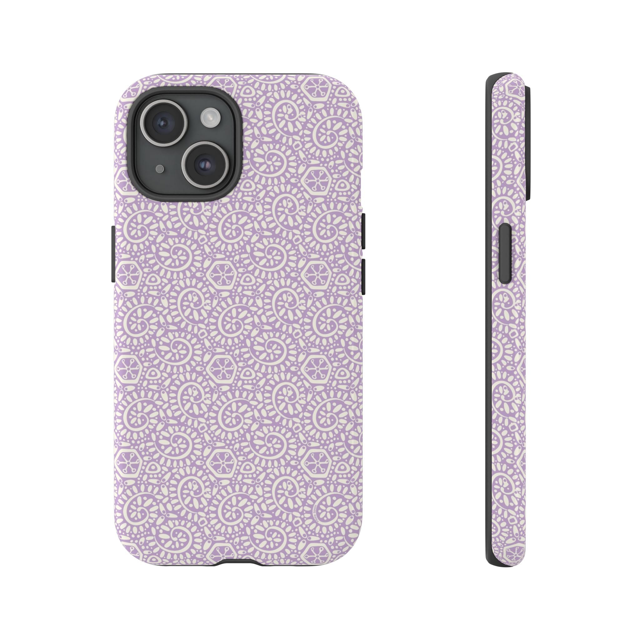 Canto Swirls Lavender iPhone 15 Glossy Case — lavender hard case covered in an intricate folk-art medallion pattern of radiating circular motifs, dot clusters, and geometric centers