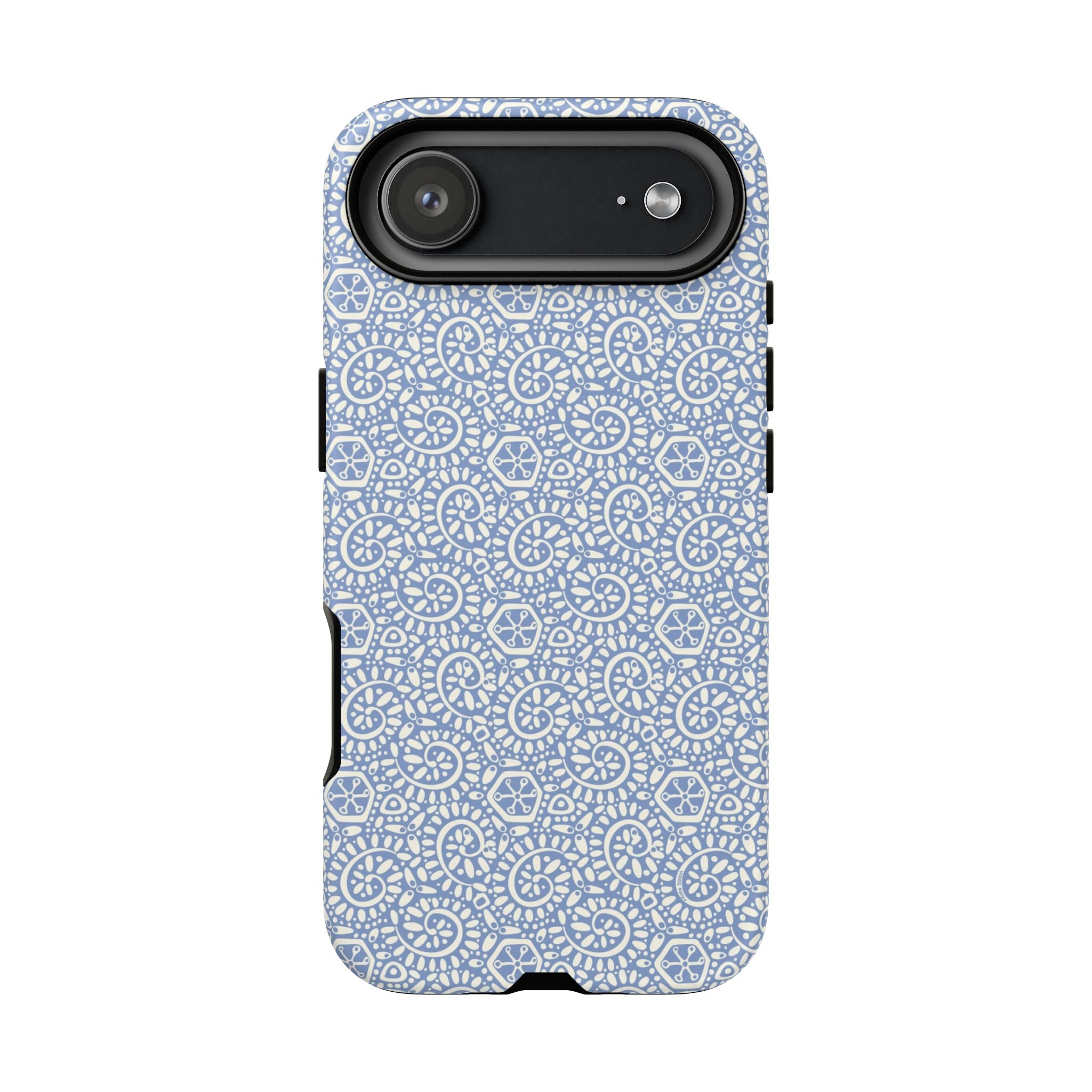 Canto Swirls Mist iPhone 17 Air Glossy Case — periwinkle blue hard case covered in an intricate folk-art medallion pattern of radiating white circular motifs, dot clusters, and geometric centers