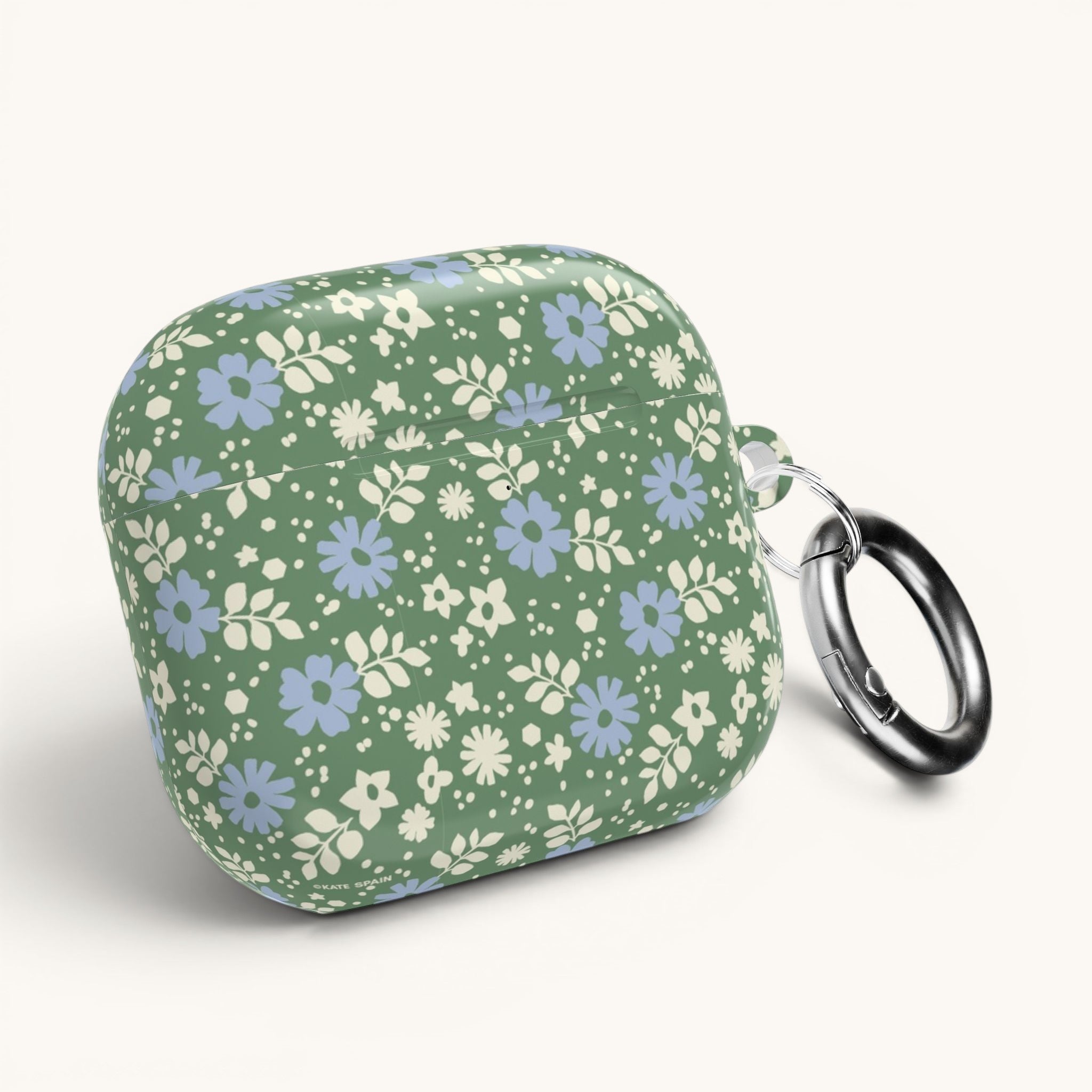 AirPods Gen 4 case – Glossy | periwinkle and cream ditsy flowers on sage green ground — angled view with keychain ring on case